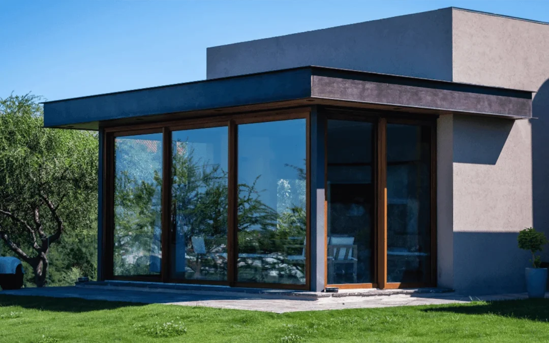 Glass House Extensions: A modern architectural design featuring a spacious interior flooded with natural light through floor-to-ceiling windows.